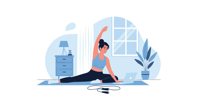 A young woman in sportswear performs a stretching exercise on a yoga mat at home, following an online class on her laptop.
