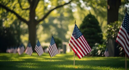American flags planted in a serene outdoor setting with lush greenery and sunlight filtering through trees