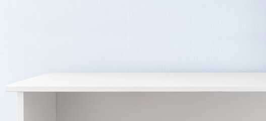 White table against blue wall