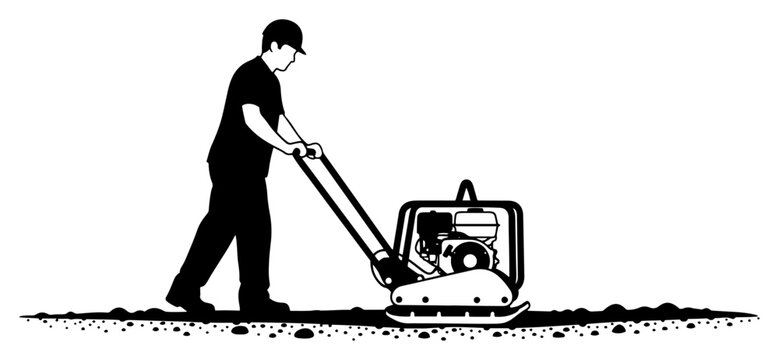 Construction worker operating a vibratory plate compactor on ground surface