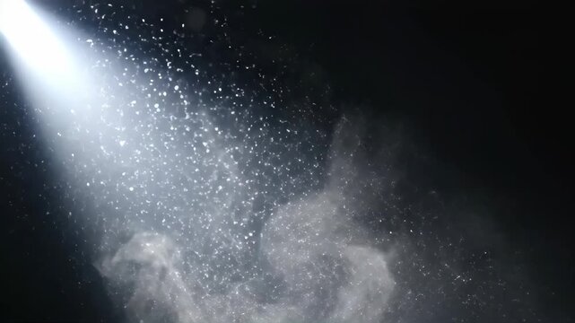Beam of light shining through darkness with floating dust particles. Cinematic spotlight ray illuminating smoke and motes in a dark room. Mystery concept
