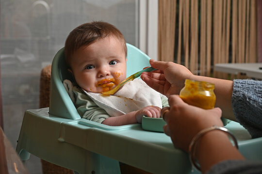 young child in a high chair to eat his meal