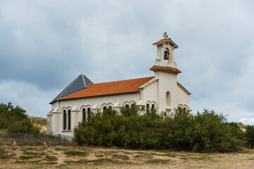 Chapel of Sainte-Therese in Labenne, France, under a cloudy sky.