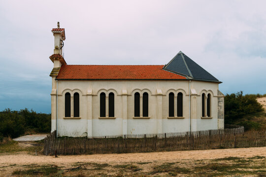 Chapel of Sainte-Therese in Labenne, France, under a cloudy sky.