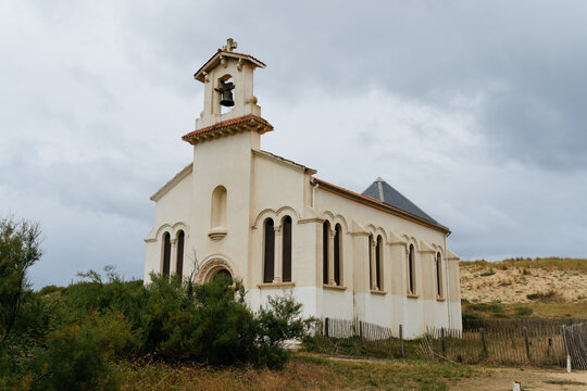 Chapel of Sainte-Therese in Labenne, France, under a cloudy sky.