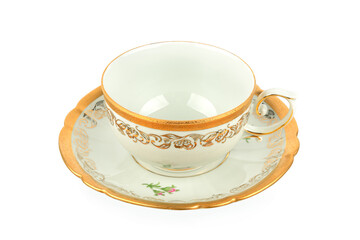 Elegant vintage porcelain teacup and saucer with gold filigree pattern