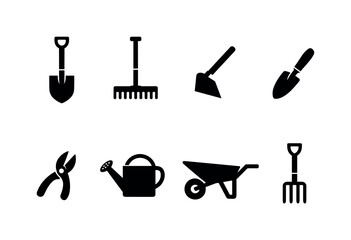 Obraz premium Home garden hand tools: shovel, rake, hoe, hand trowel, pruning shear, watering can, wheelbarrow, garden fork