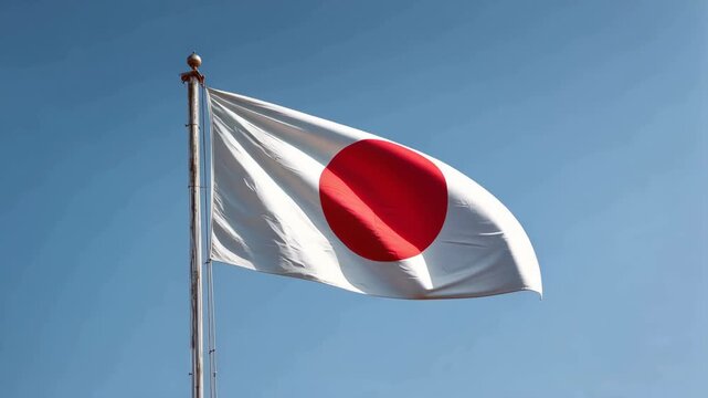Japanese National Flag Waving Against Clear Blue Sky with Smooth Fabric Movement and Vibrant Colors