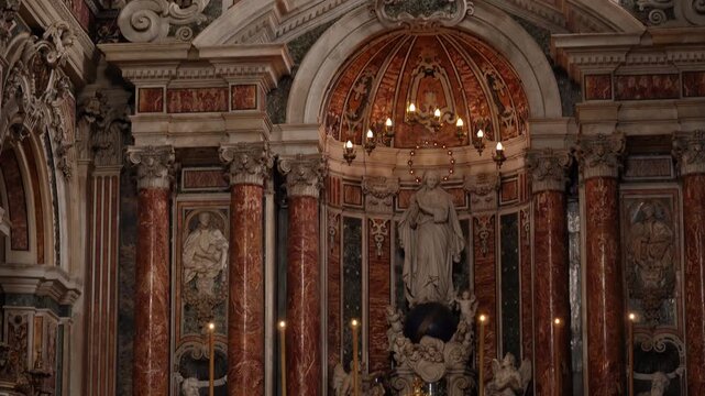 An exquisite Baroque altar and statues in a historic Italian church. A panoramic view showcases the incredible craftsmanship of this Baroque church altar in Naples, Italy, on February 21, 2026.