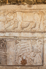 Obraz premium Close-up stone carved images on the Pyramid B famous for atlases of Tula, an archeological site in Mexico. The site of Tula de Allende was the capital of the Toltecs