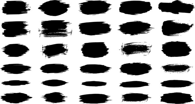 Collection of black brush strokes and smudges on white background