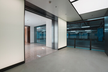 Modern office building underground parking garage entrance corridor with clean architectural details