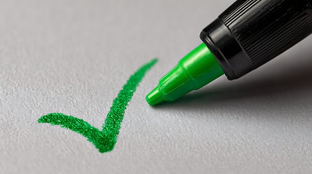 Elegant poto of Green checkmark drawn on white paper with a green marker, isolated on white background