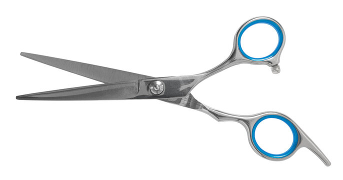 Hairdressing scissors close-up on a white isolated background