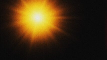Obraz premium Bright Sunburst Flare Against Dark Background Abstract Light Effect