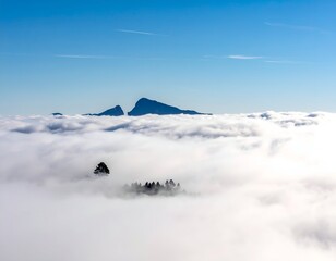 Majestic Mountain Peaks Rising Above Sea of Clouds
