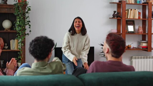 Young woman playing charades with friends at home