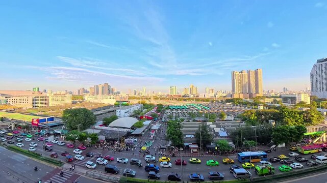 BANGKOK, THAILAND - NOV 2025 : Aerial high angle view of Chatuchak Weekend Market. Largest market in Thailand. Travel and tourism concept video. Time lapse shot, sunset to night.