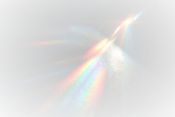 Iridescent rainbow streaks blur softly across dark canvas. Prism reflections shimmer in vibrant multicolor light. Holographic overlay enhances dreamy magical effect.  © Freesstock