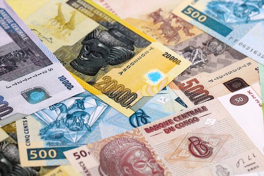 CFA franc money bills pile on table. Republic of the Congo banknotes of XAF currency close up.