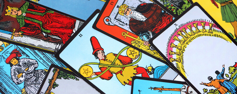Big pile of different classical tarot cards on table. Pattern of tarot cards with traditional standard meanings
