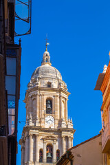 Obraz premium Detailed view of Malaga Cathedral entrance with stone stairs and Baroque architecture