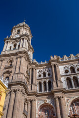 Obraz premium Facade of Malaga Cathedral with ornate stone carvings and Renaissance columns