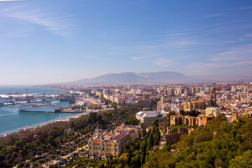 Fototapeta premium Malaga city skyline with historical architecture and Malaga Cathedral viewed from Gibralfaro hill in La Malagueta district area under a clear blue sky during a bright sunny day in Andalusia Spain.