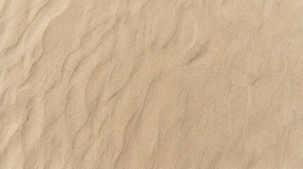 Obraz premium Aerial view of undulating sand dunes in a desert landscape, showcasing natural texture and pattern
