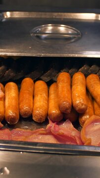 Sausages and bacon rashers with sausage roll pastry hot plate food counter