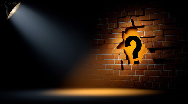 Spotlight illuminating a question mark behind a broken brick wall with copy space