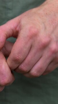 Wringing hands man is worried stressed anxious uncomfortable body language