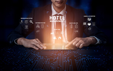 Businessman Using Technology to Manage Hotel Operations with Digital Interfaces and Analytics for...