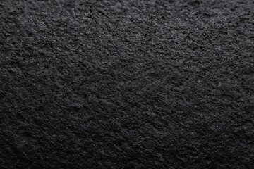 Natural black basalt or pumice stone texture with rough porous surface