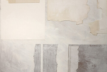 Torn, ripped blot crack crumble collage frame paper pieces. Gray, beige white copy space grunge relief grain texture poster background.