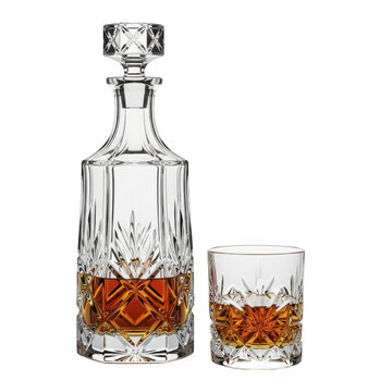 A glass decanter and a glass with whiskey on a white background