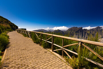 Fototapeta premium Aerial View of a Portuguese Village in a Mountain Valley, Miradouros do Paredão, Madeira, background or wallpaper