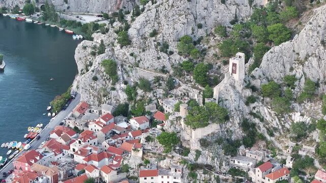 Historic center of Omis with Mirabela fortress rising above town, Dalmatia, Croatia.