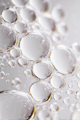 Fototapeta premium Transparent foam bubbles close up macro detail against bathroom background. Cleanliness and hygiene concept.