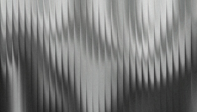 Grainy ribbed abstract textured metallic surface with vertical linear patterns creating a dynamic visual effect in grayscale tones