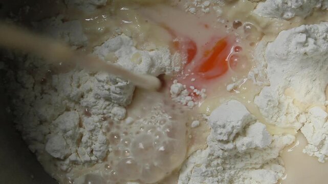 close up of pouring milk into the mixture