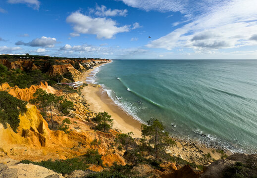 Barranco Beach, Algarve, amazing desert beach between cliffs in southern Portugal with incredible blue water