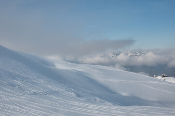 Fototapeta premium Wind shaped snow dunes in Swiss alpine winter