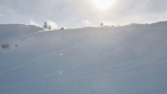 Minimalist snow covered alpine slope in soft winter light, Stoos Switzerland