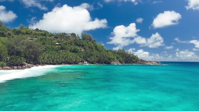 Drone viewpoint of beautiful Seychelles coastline on a sunny day