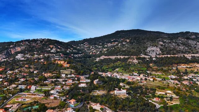 Gorgeous luxurious villas located on the slopes of majestic mountains. Aerial perspective on the scenery of Nice, France.