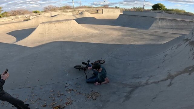 Toothpick stall crash on quarterpipe with BMX bike tricks
