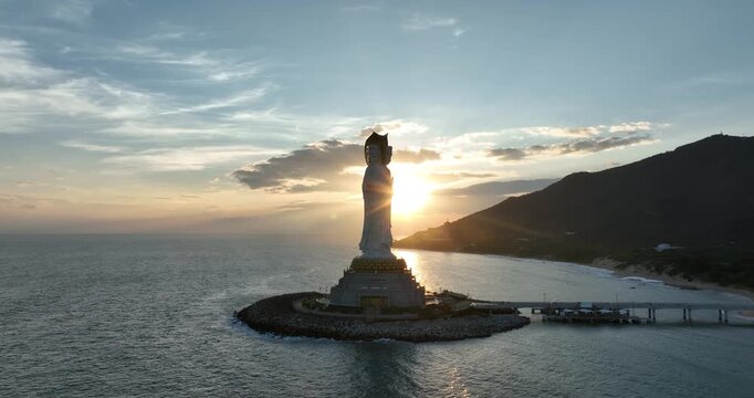 Buddhism Guanyin statue at seaside in nanshan temple, hainan island , China, words mean blessing and mercy