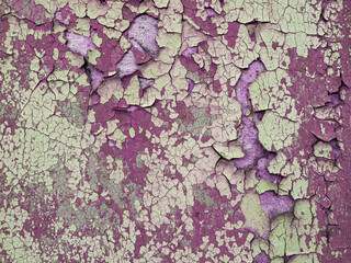 Vintage old cracked red paint wall, background texture of aging grunge surface