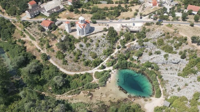 The source of river Cetina and Orhodox church located at the foothills of the Dinara mountain range in Croatia.